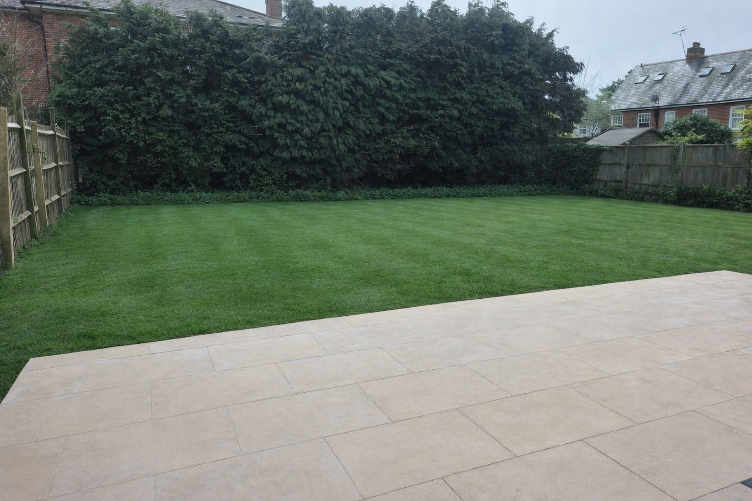 Landscaped rear garden with patio and level lawn